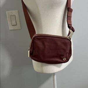 lululemon athletica Crossbody Bag in Burgundy/Maroon with Gold Hardware